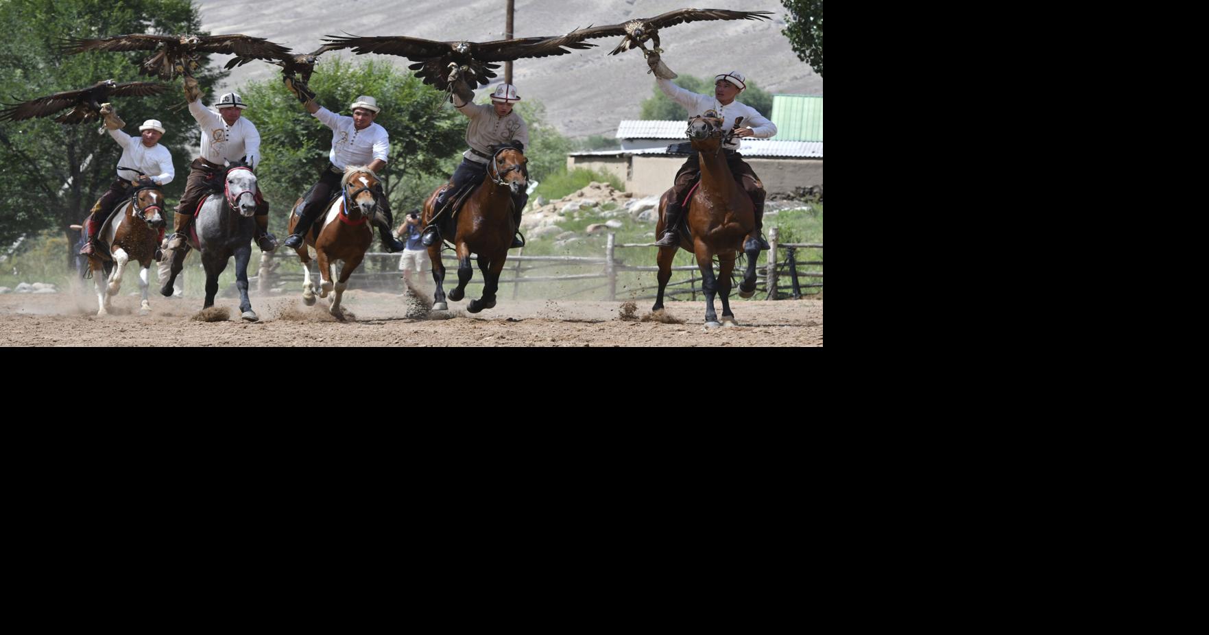Photos from Kyrgyzstan show traditional hunters with eagles at the Salbuurun festival