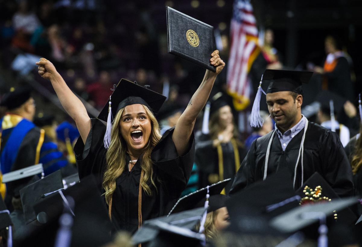 Sadie Urrestta celebrates after receiving her diploma during the University of Colorado at Colorado Springs' morning commencement ceremonies Friday, May 12, 2017, at the Broadmoor World Arena in Colorado Springs. A record 1,532 students received their degrees this Spring. (The Gazette, Christian Murdock)