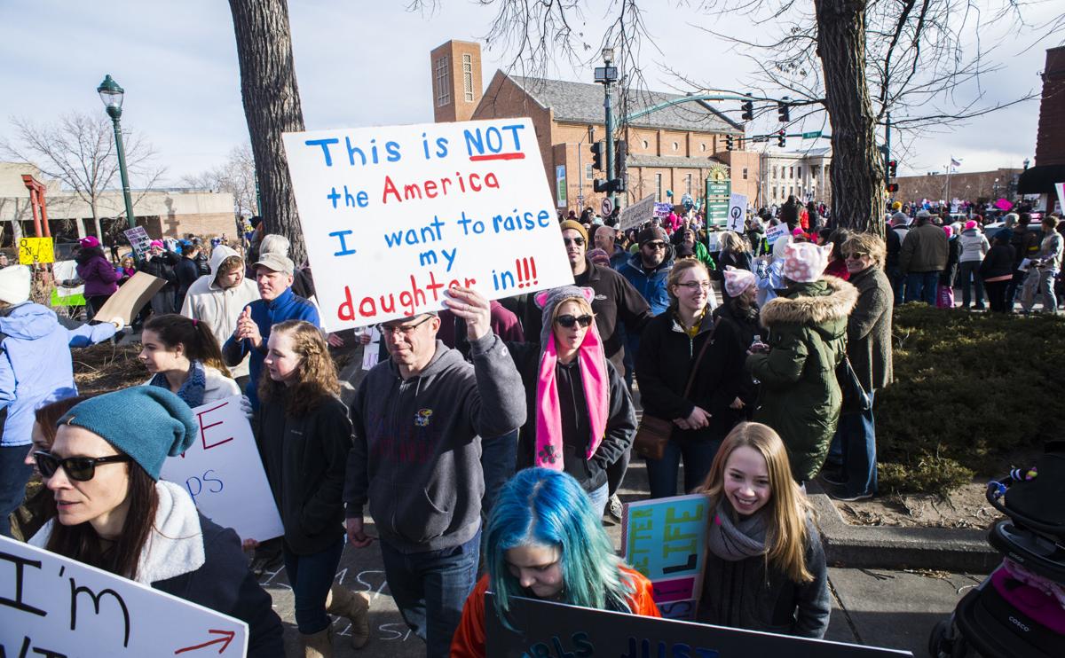 Protesters march back to Acacia Park Saturday, Jan. 21, 2017, during the Colorado Springs Women's March in downtown Colorado Springs. The sister march of the Women's March on Washington, D.C., drew between 5,000 and 10,000 people. (The Gazette, Christian Murdock)