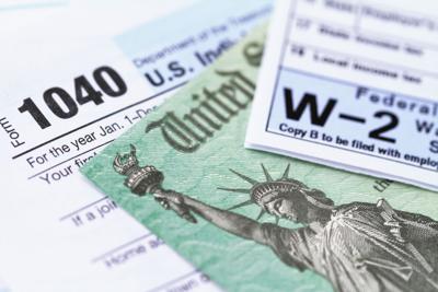 IRS tax forms with tax refund check taxes tabor dg