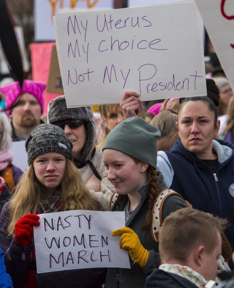 Protesters listen to speakers in Acacia Park Saturday, Jan. 21, 2017, before marching down Tejon Street during the Colorado Springs Women's March in downtown Colorado Springs. The sister march of the Women's March on Washington, D.C., drew between 5,000 and 10,000 people. (The Gazette, Christian Murdock)