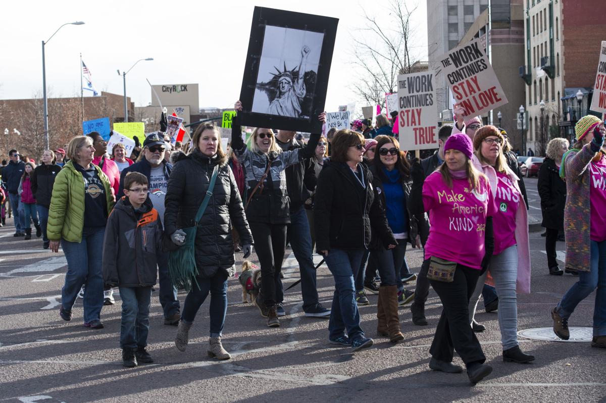 Protesters march down Nevada Avenue Saturday, Jan. 21, 2017, during the Colorado Springs Women's March in downtown Colorado Springs. The sister march of the Women's March on Washington, D.C., drew between 5,000 and 10,000 people. (The Gazette, Christian Murdock)