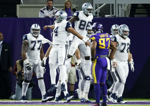 Cowboys hold on against Vikings for 11th straight win