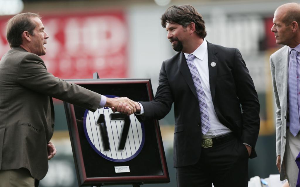 Colorado Rockies' Todd Helton (17) is congratulated by teammate