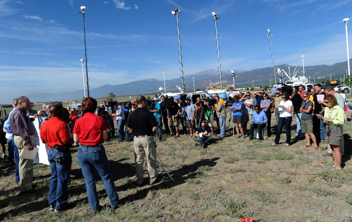 El Paso County Sheriff Terry Maketa updates the press and Black Forest residents from the Pikes Peak Communty College Rampart campus with the scar from last summer's Waldo Canyon Fire in the background Wednesday, June 12, 2013, during the second day of the Black Forest Fire. (The Gazette, Christian Murdock)