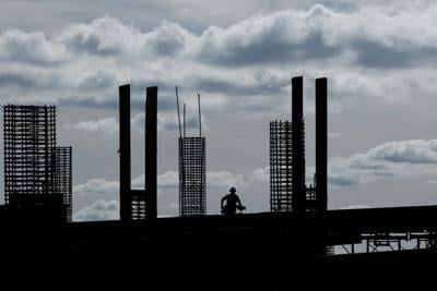 FILE PHOTO: Construction worker silhouetted during morning light (copy)