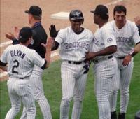 Colorado Rockies' Vinny Castilla, right, is congratulated by