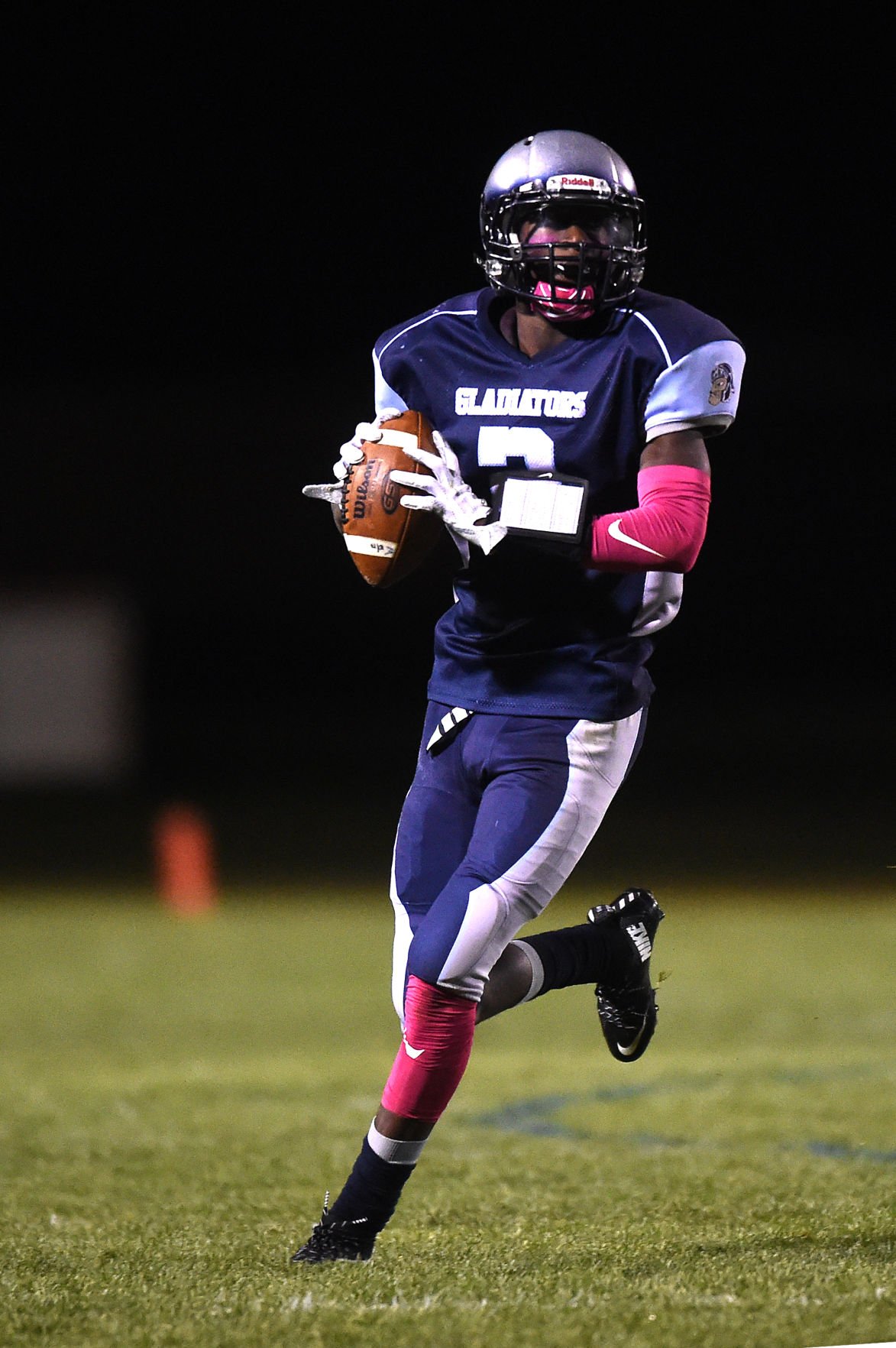 Widefield quarterback Tj Davis looks for an open receiver at CA Foster Widefield on Friday, Oct. 13, 2017. Davis ran in the Gladiator's first run during their first possession.  (The Gazette, Nadav Soroker)