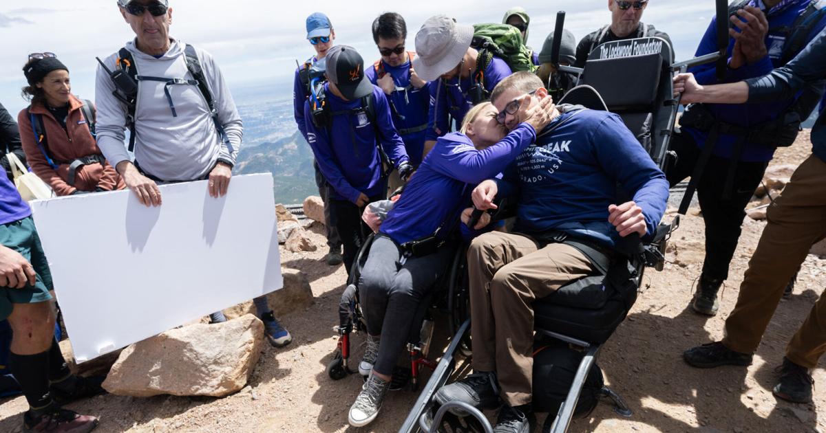 Alongside unlikely team, Colorado Springs teen in wheelchair summits Pikes Peak