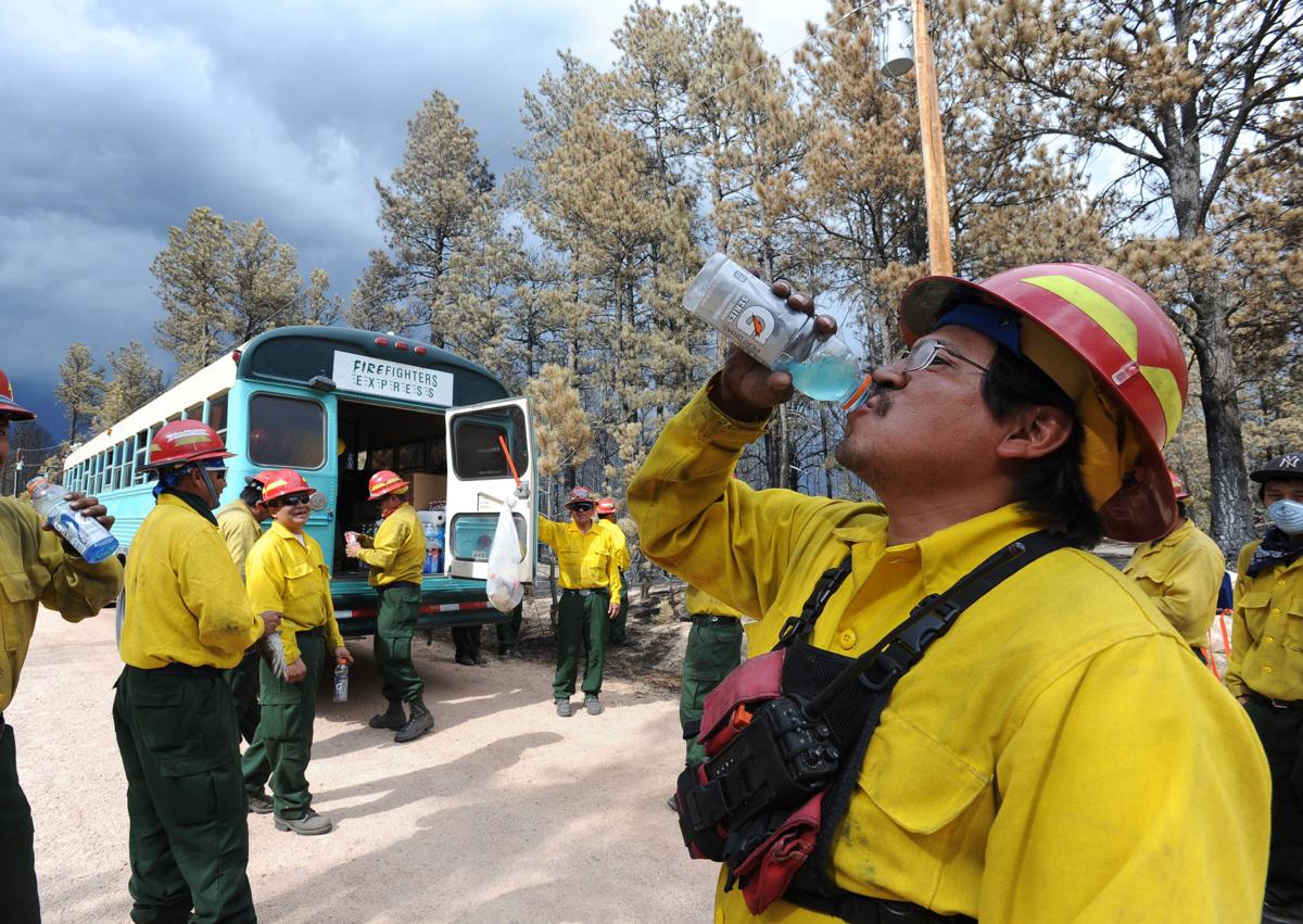 When thunderstorms threatened the Black Forest area, a group of firefighters from Ramah, New Mexico, take a break from knocking down hot spots along Porcupine Ln. Homeowners that are north of Burgess Rd. and east of Vollmer Rd. in the Black Forest burn area were able to return to their homes today on Tuesday, June 18, 2013.(Jerilee Bennett/The Gazette)