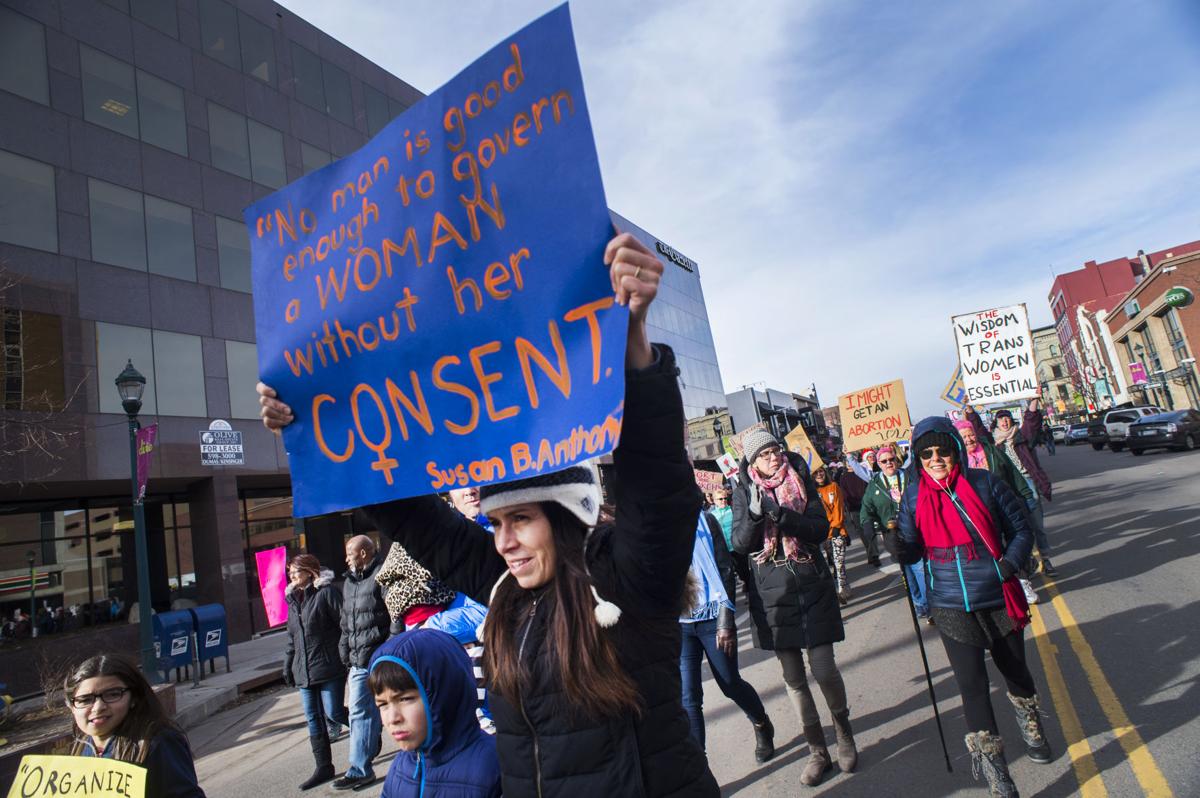 Protesters march down Tejon Street Saturday, Jan. 21, 2017, during the Colorado Springs Women's March in downtown Colorado Springs. The sister march of the Women's March on Washington, D.C., drew between 5,000 and 10,000 people. (The Gazette, Christian Murdock)