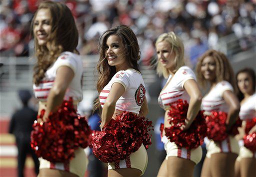 San Francisco 49ers cheerleader takes a knee during national anthem