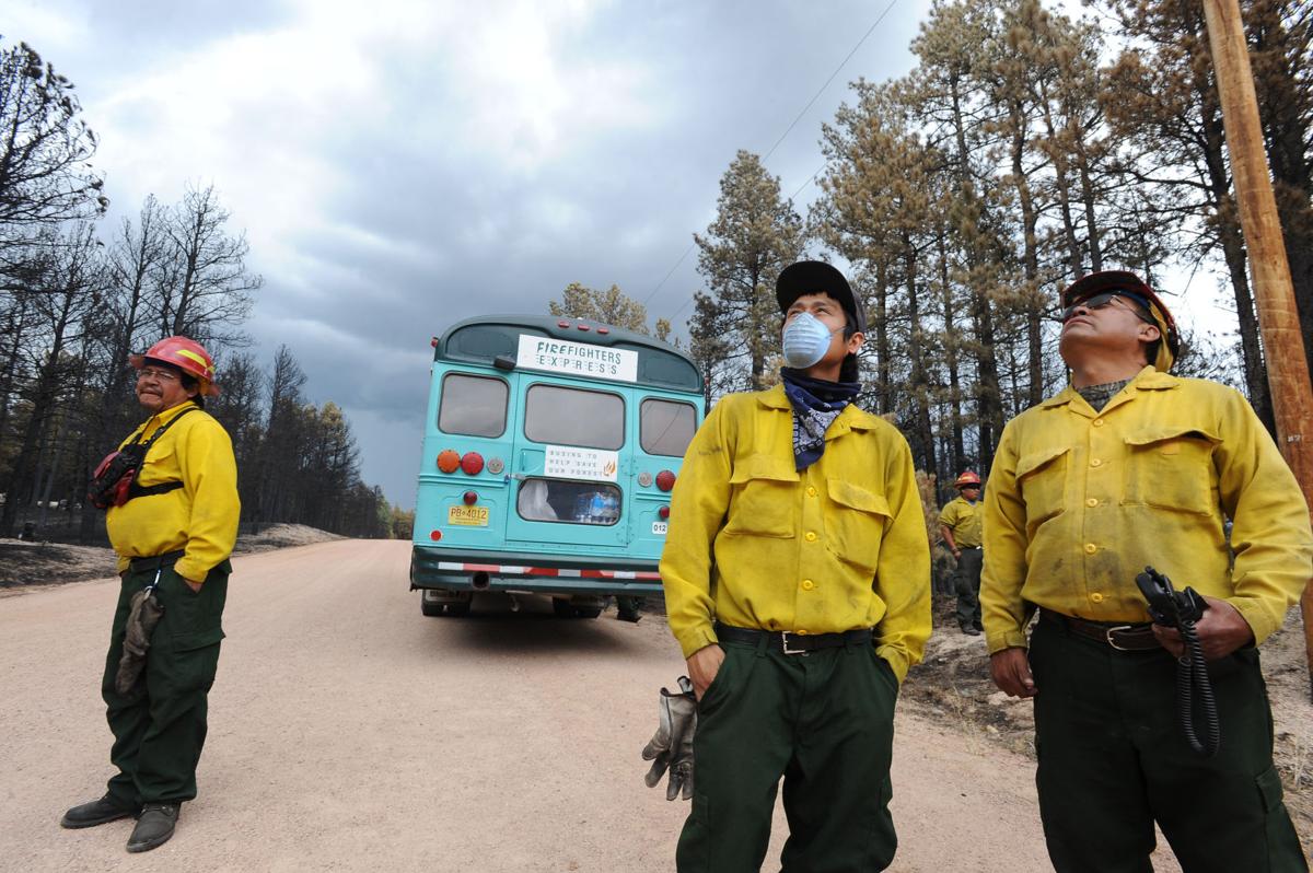 When thunderstorms threatened the Black Forest area, a group of firefighters from Ramah, New Mexico, take a break from knocking down hot spots along Porcupine Ln. Homeowners that are north of Burgess Rd. and east of Vollmer Rd. in the Black Forest burn area were able to return to their homes today on Tuesday, June 18, 2013.(Jerilee Bennett/The Gazette)