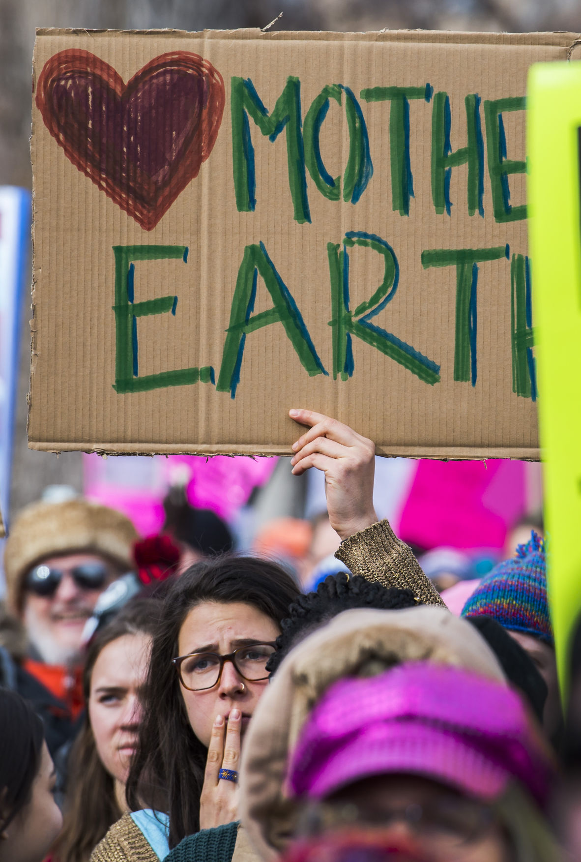 Protesters listen to speakers in Acacia Park Saturday, Jan. 21, 2017, before marching down Tejon Street during the Colorado Springs Women's March in downtown Colorado Springs. The sister march of the Women's March on Washington, D.C., drew between 5,000 and 10,000 people. (The Gazette, Christian Murdock)