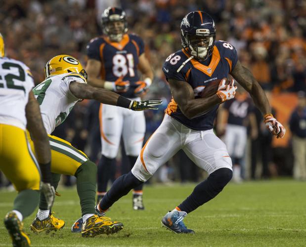 Quarterback Peyton Manning (18) congratulates Demaryius Thomas (88) after  scoring a touchdown – Denver Broncos History