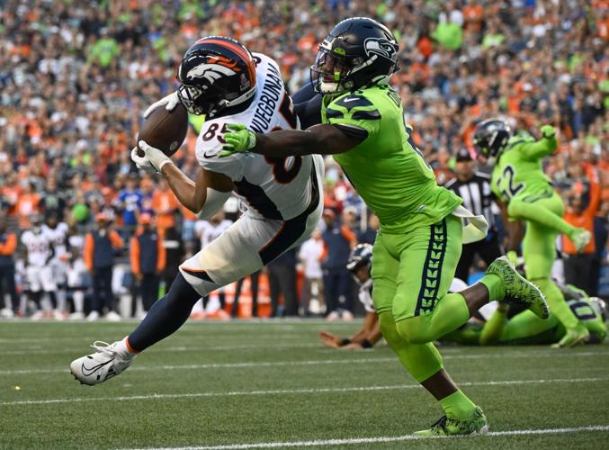 Seahawks' Quandre Diggs tackles Denver Broncos' Albert Okwuegbunam