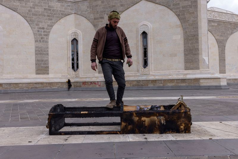 Amid Ashes Of Assad Family's Mausoleum, Syrian Rebels Vow To Erase ...