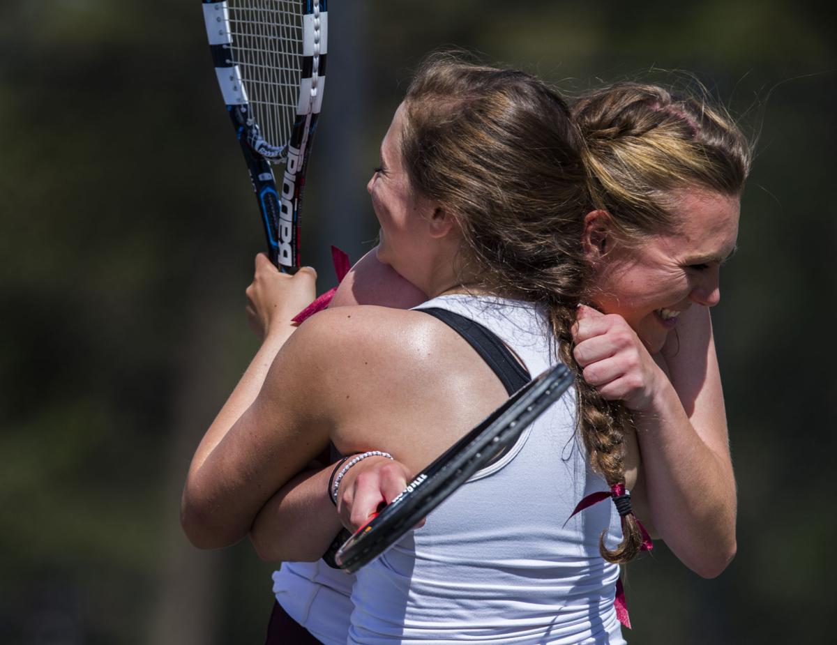 Cheyenne Mountain’s Taylor Heinicke, right, and Arianna Arenson hug after winning the No. 2 Doubles finals Saturday, May 13, 2017, at the 4A State Tennis Championships in Pueblo. Cheyenne Mountain’s Arenson and Heinicke defeated Palmer Ridge’s Bali Fitzpatrick and Ciara Bobak 6-4, 6-1. (The Gazette, Christian Murdock)