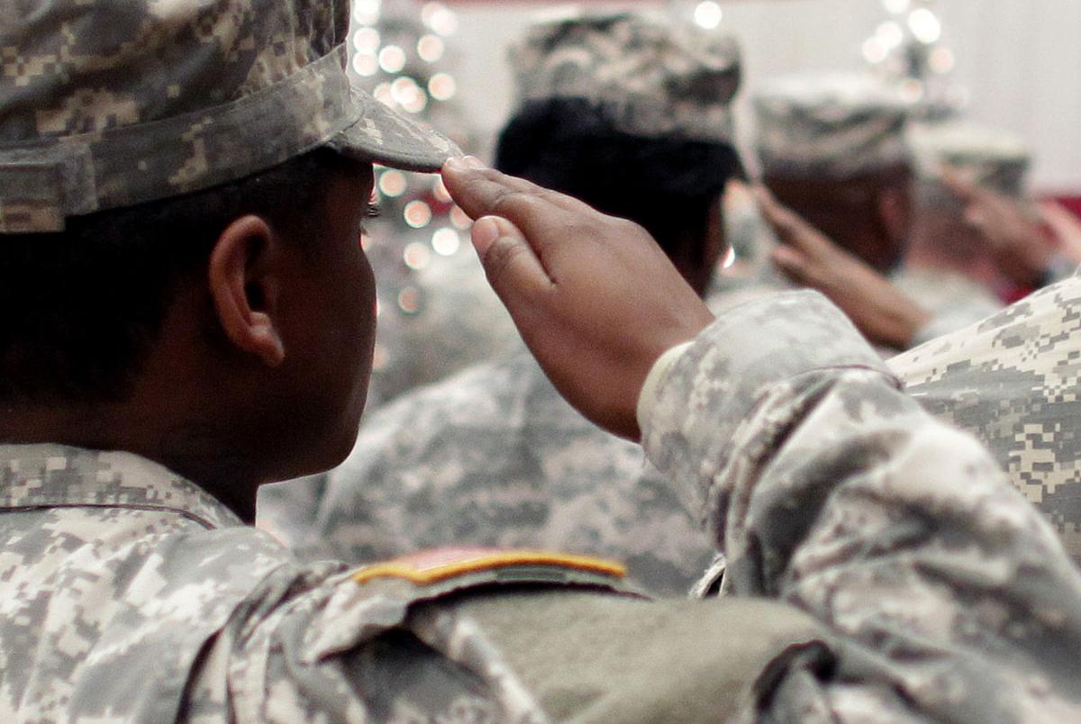 Soldiers salute the U.S. Flag