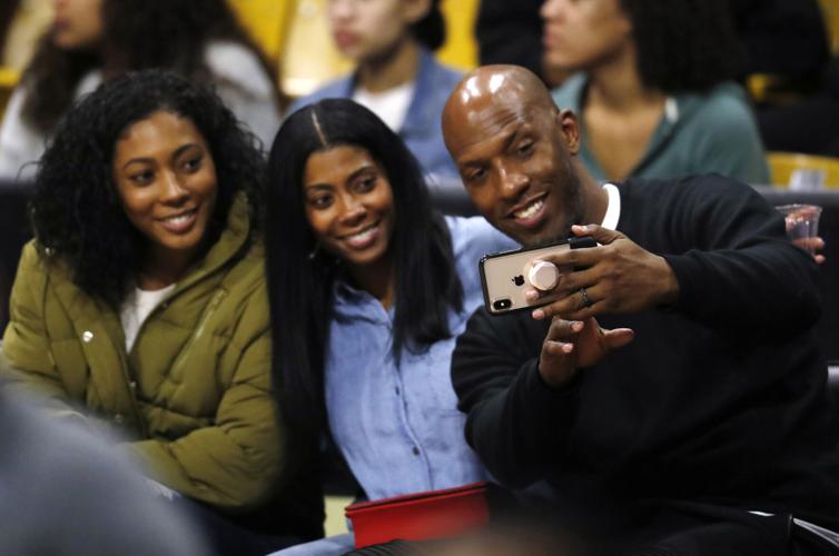 Retired NBA star Chauncey Billups, left, and his wife are pictured