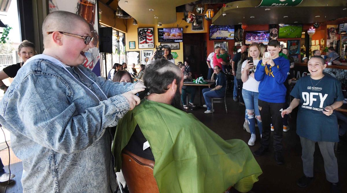 Shaved heads for solidarity