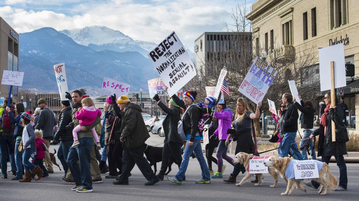 Protesters march down Tejon Street Saturday, Jan. 21, 2017, during the Colorado Springs Women's March in downtown Colorado Springs. The sister march of the Women's March on Washington, D.C., drew between 5,000 and 10,000 people. (The Gazette, Christian Murdock)