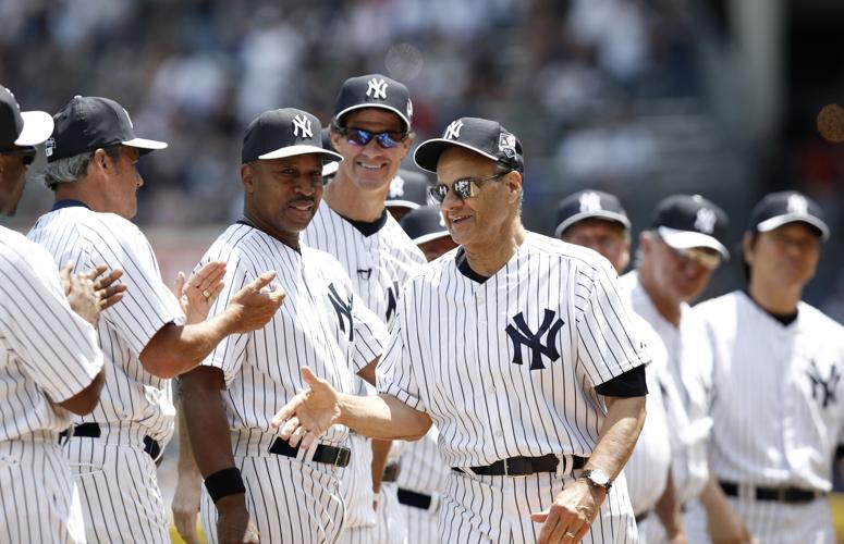 Retired New York Yankee pitcher Goose Gossage waves while standing with his  monument that will be placed in Monument Park at the 68th Annual  Old-Timers' Day before the New York Yankees play