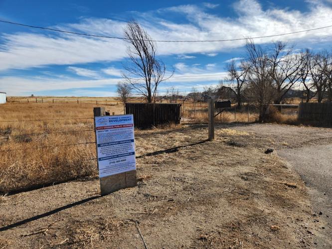 A sign with information about a 3,200 acre parcel asking to join the city of Colorado Springs is pictured near the property on the eastern edge of Fountain during December 2022. (copy)