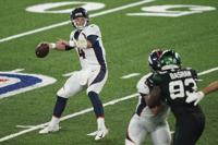 Denver Broncos quarterback Brett Rypien throws a pass during the