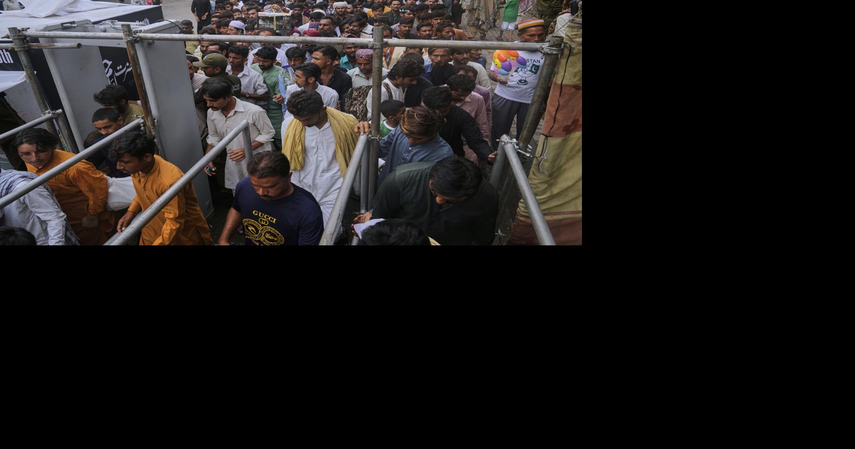 Photos of Pakistan honoring a Sufi saint with drumming, dancing, and bright lights
