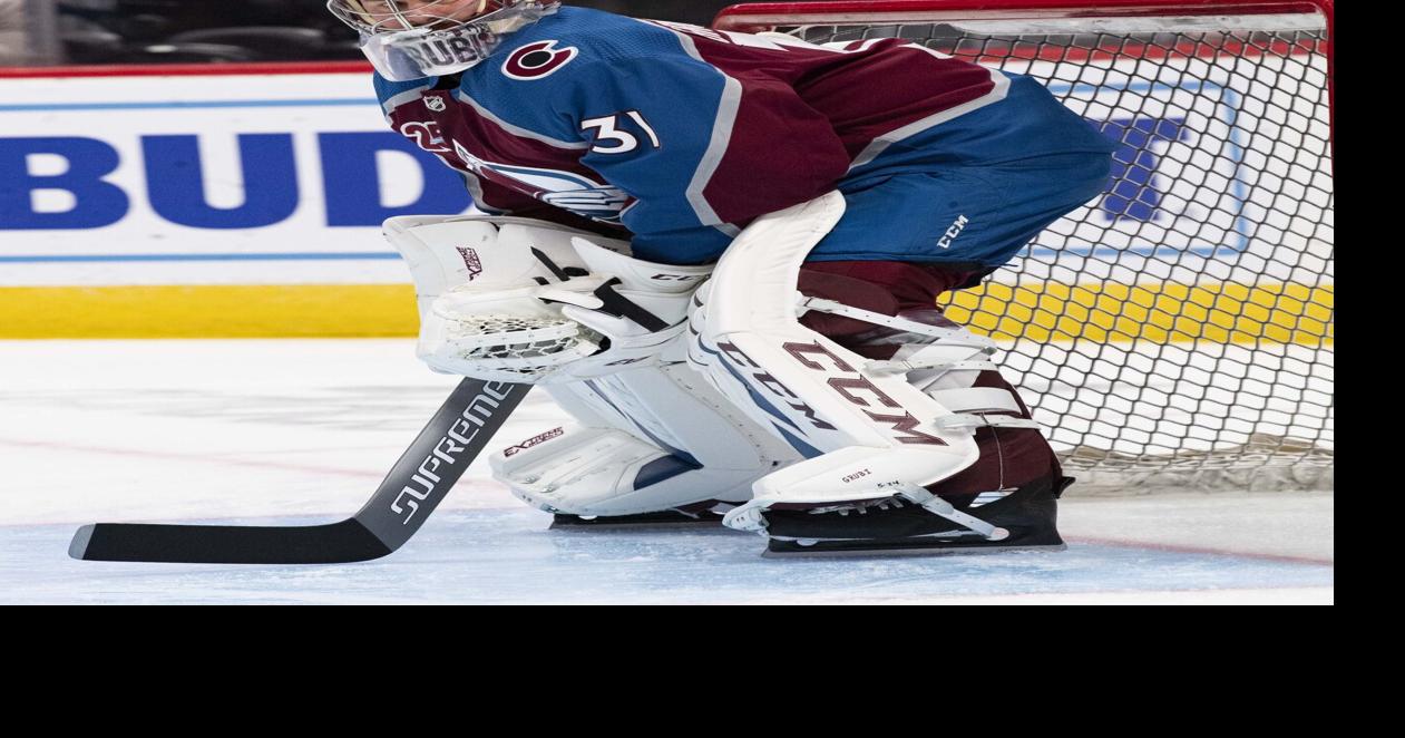 Goalie Patrick Roy of the Colorado Avalanche warms up prior to facing