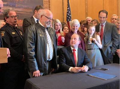 Gov Polis Signs Controversial Red Flag Gun Bill Into Colorado