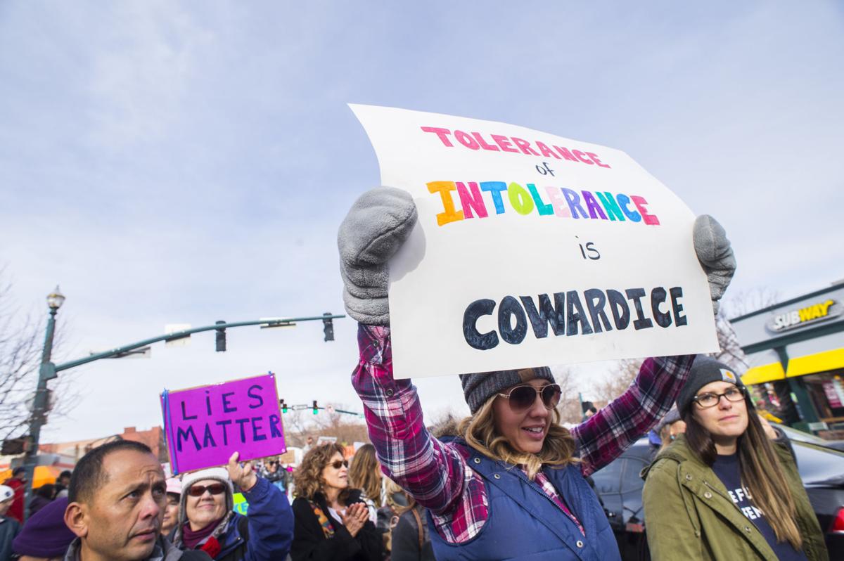 Protesters march down Tejon Street Saturday, Jan. 21, 2017, during the Colorado Springs Women's March in downtown Colorado Springs. The sister march of the Women's March on Washington, D.C., drew between 5,000 and 10,000 people. (The Gazette, Christian Murdock)