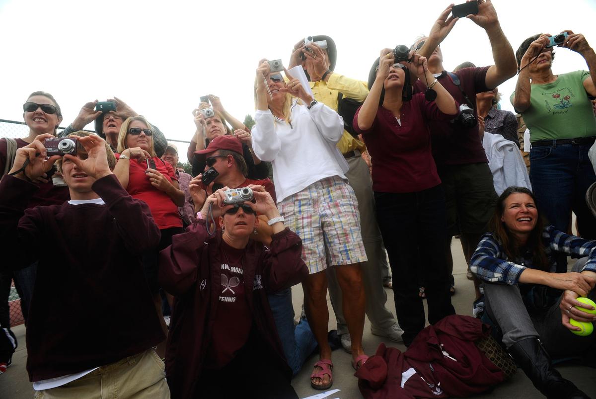 Proud family and friends take pictures of the Cheyenne Mountain boys tennis team as they receive the first-place trophy Saturday, Oct. 15, 2011, during the 4A Colorado state tennis championships at Pueblo City Park. Cheyenne Mountain won the state title. (The Gazette, Christian Murdock)