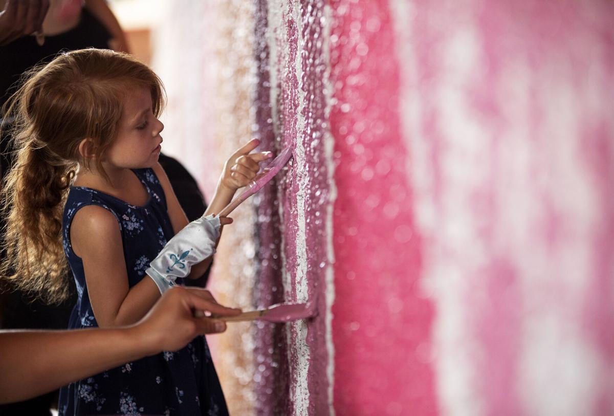 Community helps with the Conejos Mural Project