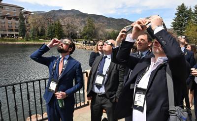A 'cosmic coincidence': Space Symposium guests marvel at solar eclipse
