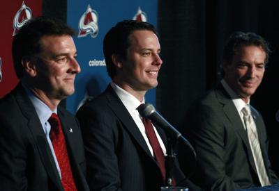 Joe Sakic, front left, jokes with his wife, Deb, during ceremony to mark  his retirement from the Colorado Avalanche before the team's home opener of  the 2009-2010 NHL season against the San
