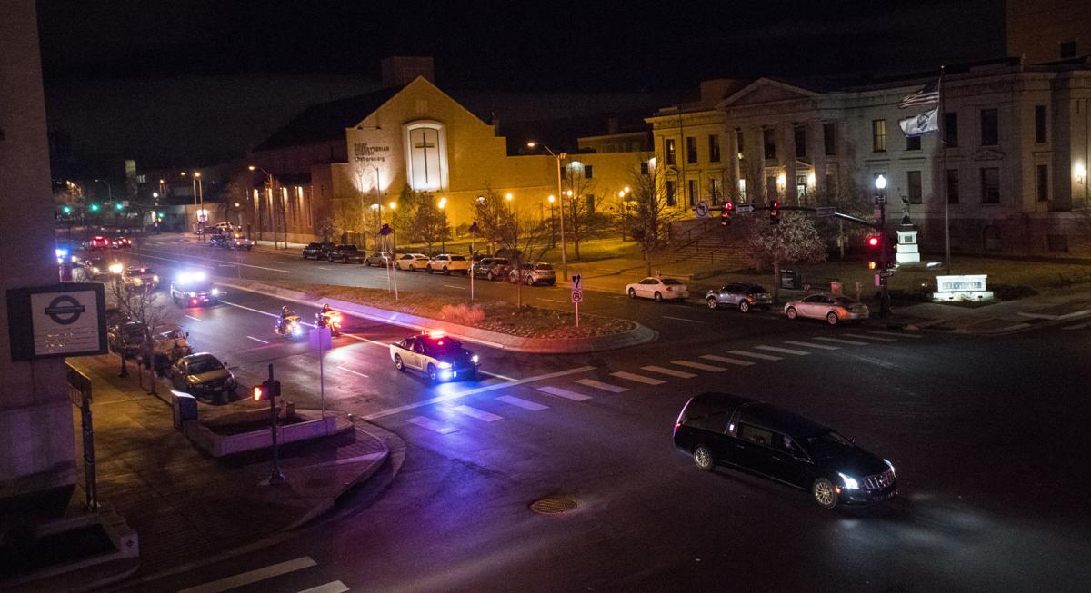 Hundreds of public safety vehicles follow the hearse carrying the body of slain El Paso County sheriff's deputy Micah Flick down Nevada Avenue Monday night, Feb. 5, 2018. The 34-year-old deputy was killed earlier in the day while investigating a stolen vehicle. (The Gazette, Christian Murdock)