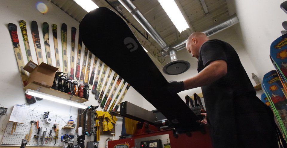 Tony Evans produces a handmade snowboard at Meier Skis