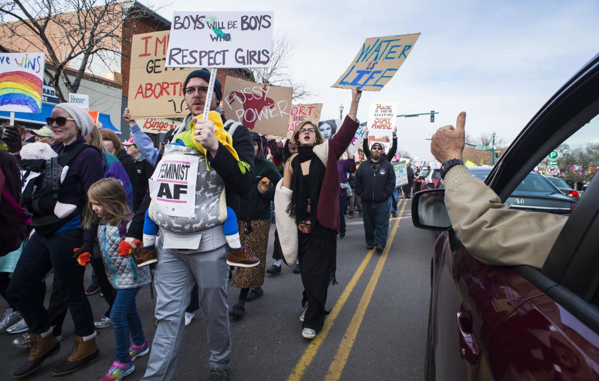 David Barfoot gives marchers a thumps up as he wait for the parade to past him at Bijou and Tejon streets Saturday, Jan. 21, 2017, during the Colorado Springs Women's March in downtown Colorado Springs. The sister march of the Women's March on Washington, D.C., drew between 5,000 and 10,000 people. (The Gazette, Christian Murdock)