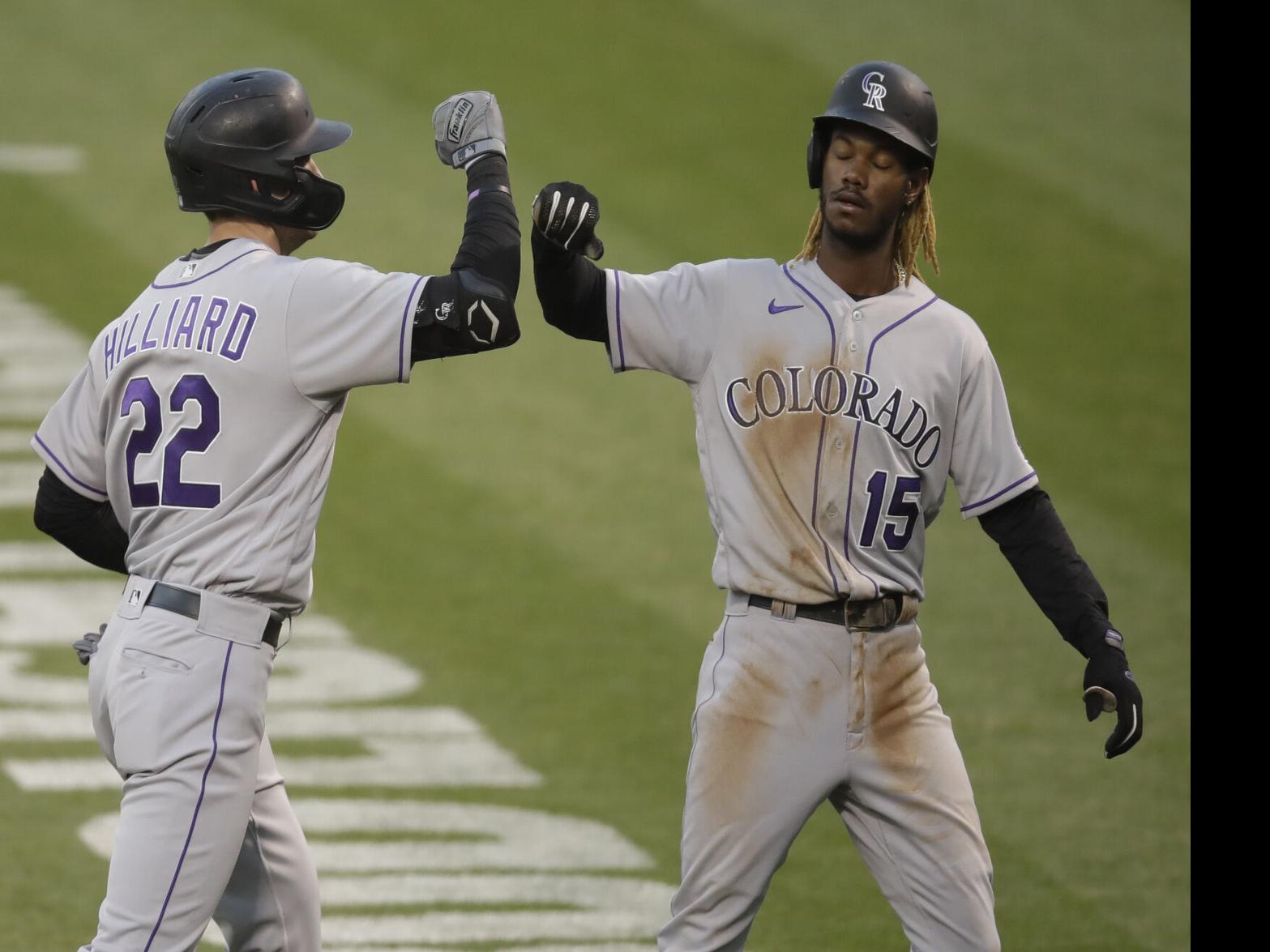 Colorado Rockies' Daniel Murphy celebrates as he scores after