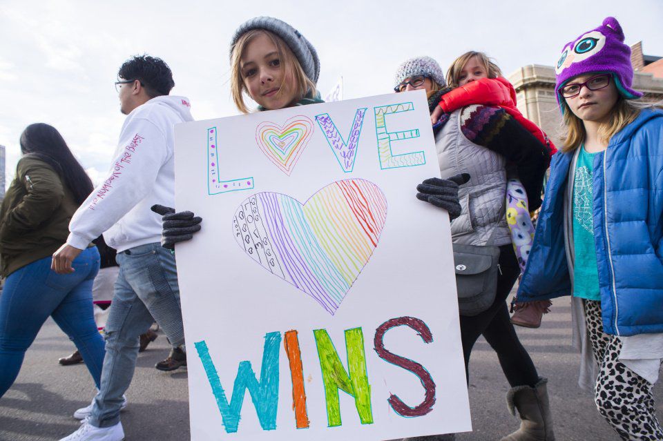 A young protester carries a sign as she marches down Tejon Street Saturday, Jan. 21, 2017, during the Colorado Springs Women's March in downtown Colorado Springs. The sister march of the Women's March on Washington, D.C., drew between 5,000 and 10,000 people. (The Gazette, Christian Murdock)