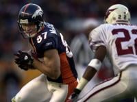 Broncos wide receiver Ed McCaffrey hauls in a pass against