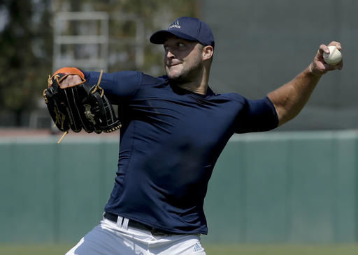 Tim Tebow works out at New York Mets camp, wearing No. 15 in orange and  blue – The Denver Post