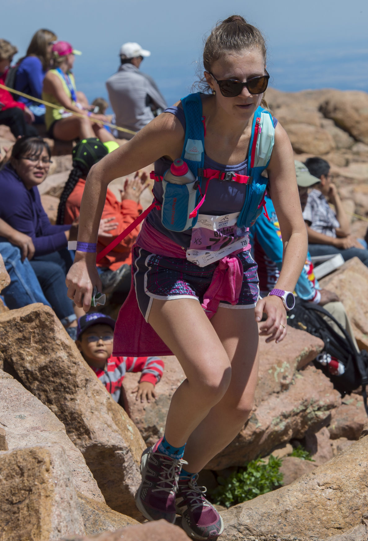 Brightin Schlumpf of Boulder, Colo., sprints to the finish of the 2015 Pikes Peak Ascent Saturday, Aug. 15, 2015, on the top of 14,115-foot Pikes Peak. The 13.2-mile race begins in Manitou Springs, Colo., and follows Barr Trail to the top of the mountain. (AP Photo/The Gazette, Christian Murdock)