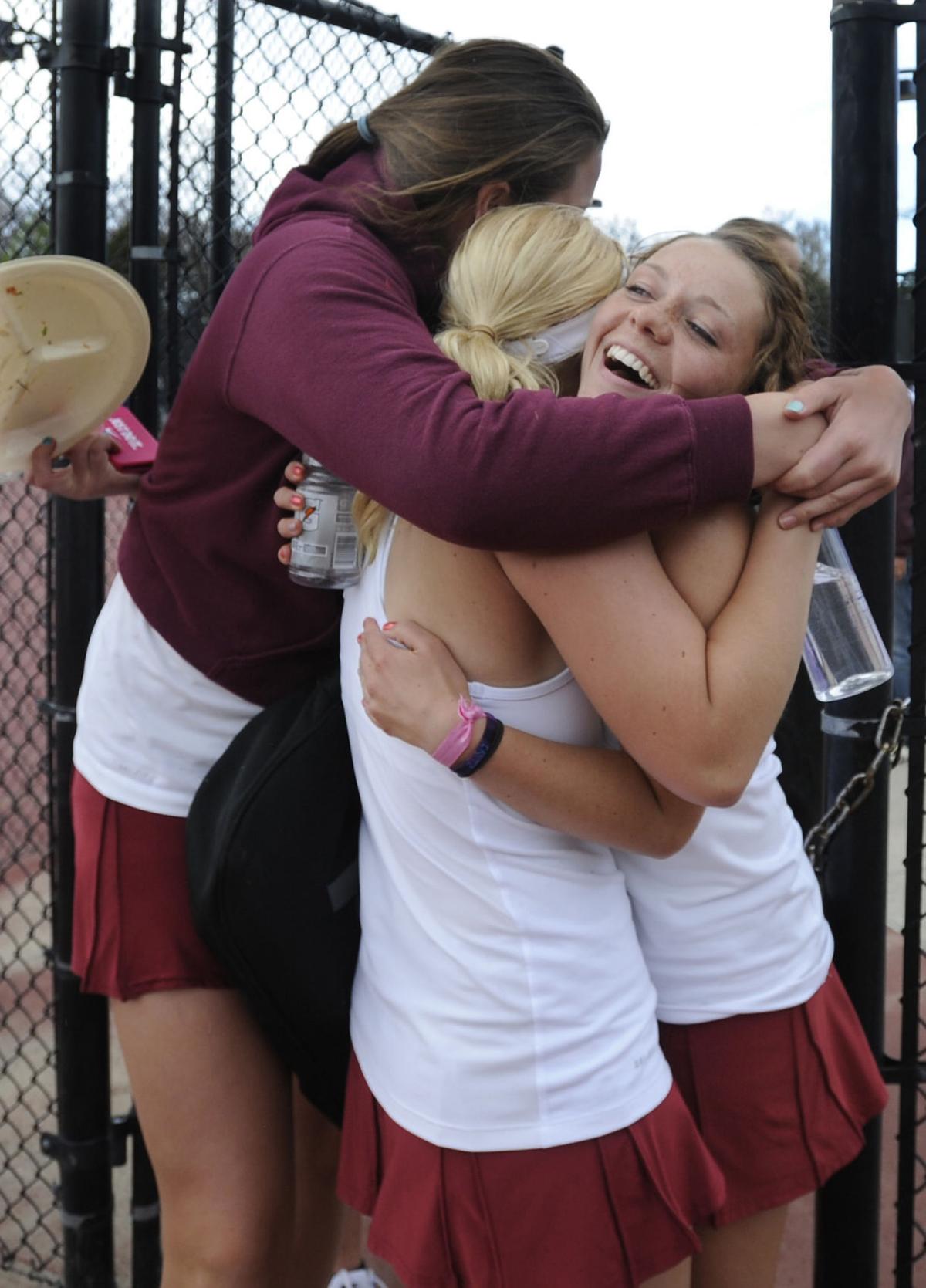 Cheyenne Mountain's Payton Fielding, Elizabeth Stegnaro and Caroline Fitzhugh celebrate after Stegnaro's win in state tennis action. It was the last match of the day for Cheyenne Mountain's girls tennis team and they won all seven of their semi-final matches at Colorado State 4A Girls Tennis in Pueblo, Colorado on Friday, May 10, 2013. Fielding plays #2 singles, Stegnaro plays #4 doubles and Fitzhugh plays #3 doubles. .(Jerilee Bennett/The Gazette)