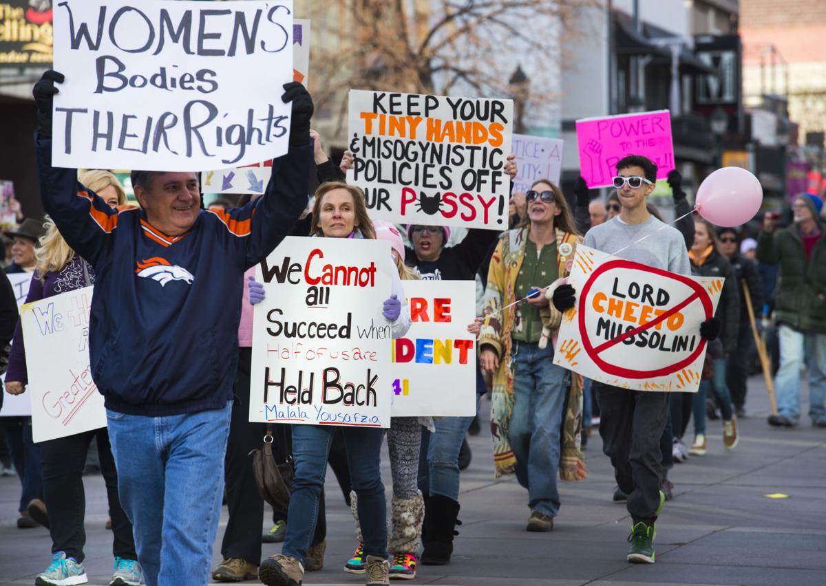 Protesters march down Tejon Street Saturday, Jan. 21, 2017, during the Colorado Springs Women's March in downtown Colorado Springs. The sister march of the Women's March on Washington, D.C., drew between 5,000 and 10,000 people. (The Gazette, Christian Murdock)