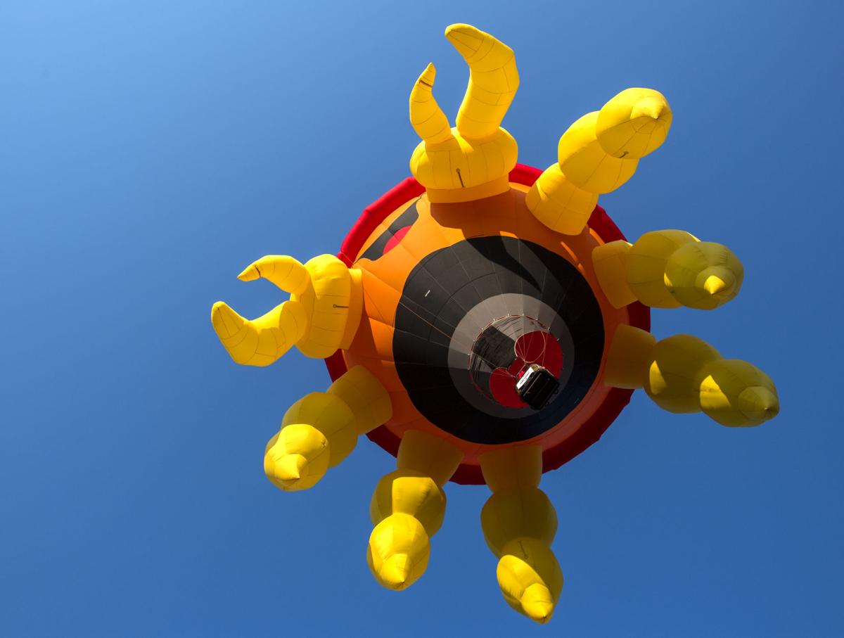 A crab-shaped balloon lifts off during the second wave Saturday, Sept. 2, 2017, on the first day of the Colorado Springs Labor Day Lift Off in Memorial Park. The balloon festival runs through Monday morning. (The Gazette, Christian Murdock)