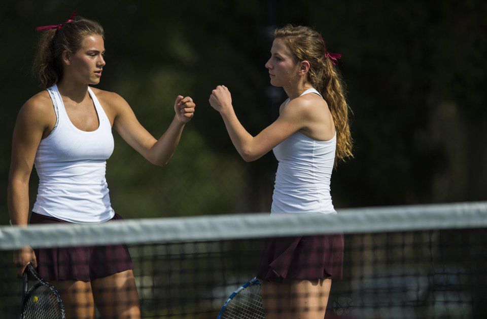 Cheyenne Mountain’s Casey Ahrendsen, left, and Ally Arenson celebrate after winning a point during No. 1 Doubles finals Saturday, May 13, 2017, at the 4A State Tennis Championships in Pueblo. The two won their fourth straight No. 1 Doubles title with a 6-1, 6-2 win over Valor Christian’s Tiffany Parobek and Lucie Hosse. (The Gazette, Christian Murdock)