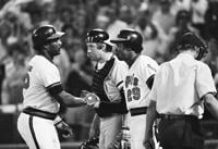 Boston Red Sox Spike Owen (5) is congratulated by teammate Jim